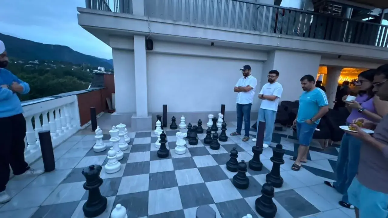 Employees Playing terrace Chess 1