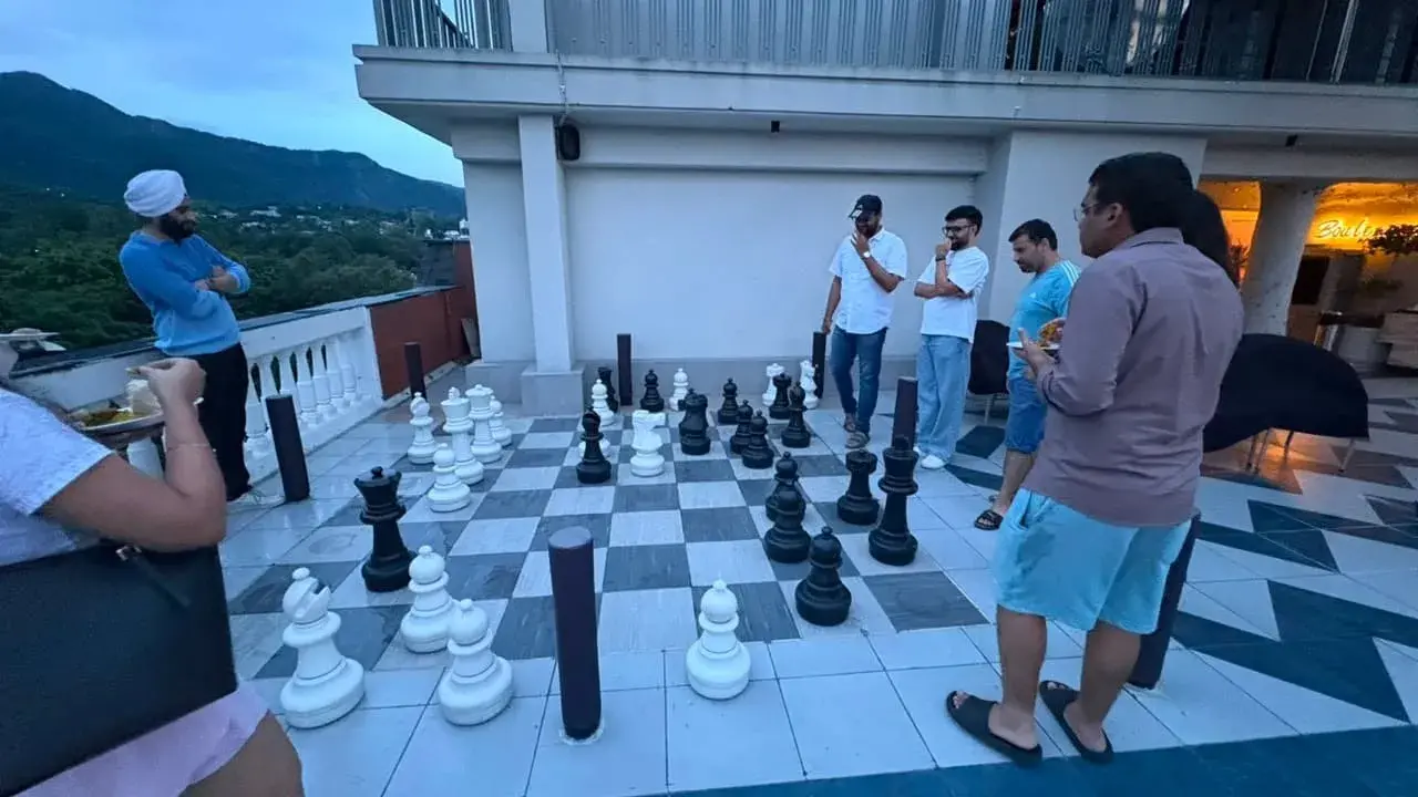 Employees Playing terrace Chess 3